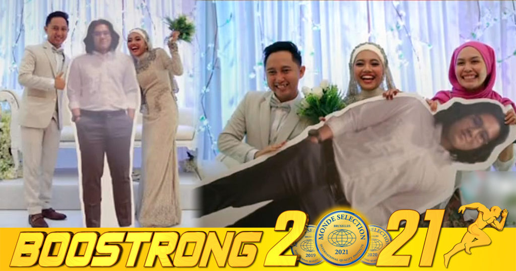 បុរសម្នាក់កើតកូវីដចូលរួមមង្គលការមិនបាន ត្រូវមិត្តភក្តិបោះពុម្ពរូបគាត់មួយជំហរ ហើយយកចូលរោងការជាមួយ ដើម្បីបានថតរូបជុំគ្នា